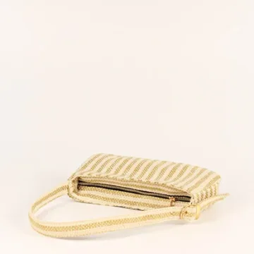 Product Description: GAIA – Organic Textured Jute Baguette Made out of artisanal handicraft jute fabric, this baguette is sturdy, simple yet has an earthy finish to it. Cotton lining inside, with adjustable straps by 3 knots. Color: Cream and Beige Stripes Length: 5.5 inches Width: 10 inches Height: 4 inches Price: ₹900/-