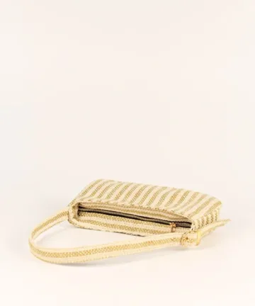 Product Description: GAIA – Organic Textured Jute Baguette Made out of artisanal handicraft jute fabric, this baguette is sturdy, simple yet has an earthy finish to it. Cotton lining inside, with adjustable straps by 3 knots. Color: Cream and Beige Stripes Length: 5.5 inches Width: 10 inches Height: 4 inches Price: ₹900/-