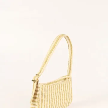 Product Description: GAIA – Organic Textured Jute Baguette Made out of artisanal handicraft jute fabric, this baguette is sturdy, simple yet has an earthy finish to it. Cotton lining inside, with adjustable straps by 3 knots. Color: Cream and Beige Stripes Length: 5.5 inches Width: 10 inches Height: 4 inches Price: ₹900/-