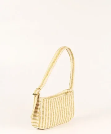 Product Description: GAIA – Organic Textured Jute Baguette Made out of artisanal handicraft jute fabric, this baguette is sturdy, simple yet has an earthy finish to it. Cotton lining inside, with adjustable straps by 3 knots. Color: Cream and Beige Stripes Length: 5.5 inches Width: 10 inches Height: 4 inches Price: ₹900/-