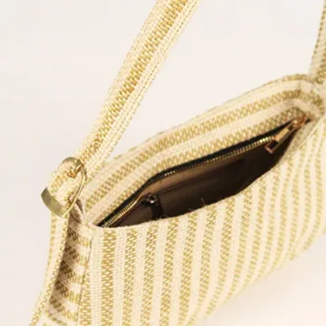Product Description: GAIA – Organic Textured Jute Baguette Made out of artisanal handicraft jute fabric, this baguette is sturdy, simple yet has an earthy finish to it. Cotton lining inside, with adjustable straps by 3 knots. Color: Cream and Beige Stripes Length: 5.5 inches Width: 10 inches Height: 4 inches Price: ₹900/-