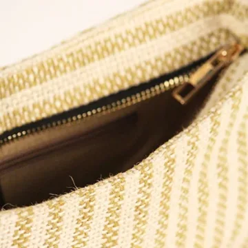 Product Description: GAIA – Organic Textured Jute Baguette Made out of artisanal handicraft jute fabric, this baguette is sturdy, simple yet has an earthy finish to it. Cotton lining inside, with adjustable straps by 3 knots. Color: Cream and Beige Stripes Length: 5.5 inches Width: 10 inches Height: 4 inches Price: ₹900/-