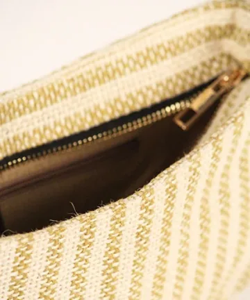Product Description: GAIA – Organic Textured Jute Baguette Made out of artisanal handicraft jute fabric, this baguette is sturdy, simple yet has an earthy finish to it. Cotton lining inside, with adjustable straps by 3 knots. Color: Cream and Beige Stripes Length: 5.5 inches Width: 10 inches Height: 4 inches Price: ₹900/-