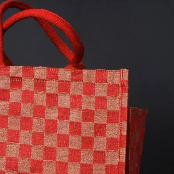 GLEN - jute mini shopping bag with bottle holder. Color: Red and Brown Length: 12 inches Width: 12 inches Height: 8 inches Price: ₹600