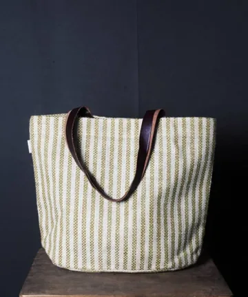 Product Description: HEATHER  Jute Mini Tote Bag Color: Cream and green Length: 12 inches Width: 15 inches Height: 5.5 inches Price: ₹700/-