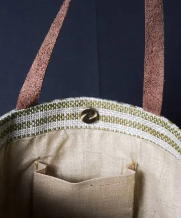 Product Description: HEATHER  Jute Mini Tote Bag Color: Cream and green Length: 12 inches Width: 15 inches Height: 5.5 inches Price: ₹700/-