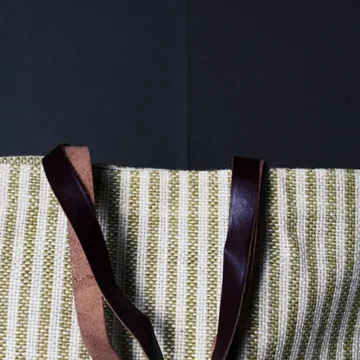 Product Description: HEATHER  Jute Mini Tote Bag Color: Cream and green Length: 12 inches Width: 15 inches Height: 5.5 inches Price: ₹700/-