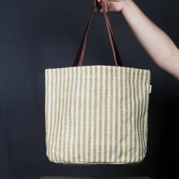 Product Description: HEATHER  Jute Mini Tote Bag Color: Cream and green Length: 12 inches Width: 15 inches Height: 5.5 inches Price: ₹700/-