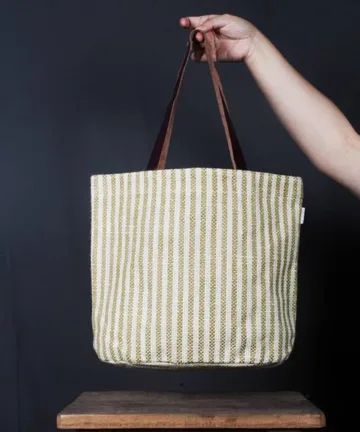 Product Description: HEATHER Jute Mini Tote Bag Color: Cream and green Length: 12 inches Width: 15 inches Height: 5.5 inches Price: ₹700/-