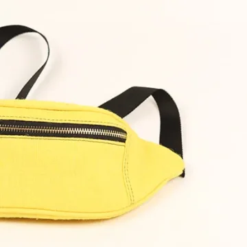 Vibrant yellow fanny pack with multiple compartments and adjustable straps. Color: Yellow Length: 5.5 inches Width: 10 inches Height: 4 inches Price: ₹800/-