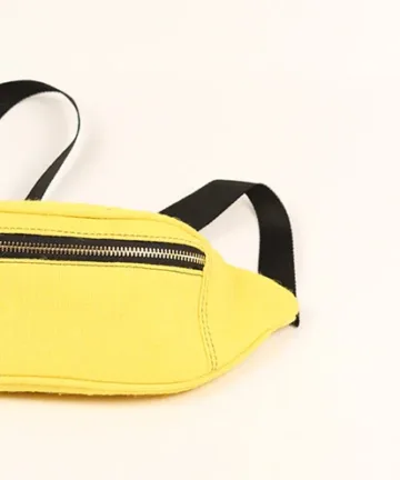 Vibrant yellow fanny pack with multiple compartments and adjustable straps. Color: Yellow Length: 5.5 inches Width: 10 inches Height: 4 inches Price: ₹800/-
