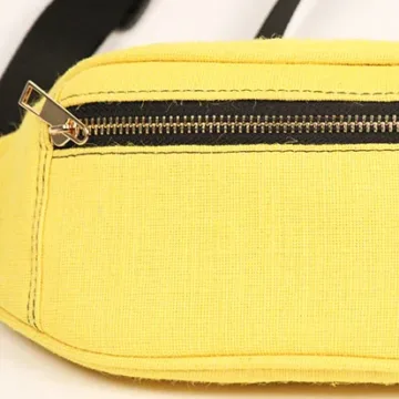 Vibrant yellow fanny pack with multiple compartments and adjustable straps. Color: Yellow Length: 5.5 inches Width: 10 inches Height: 4 inches Price: ₹800/-