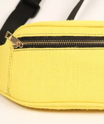 Vibrant yellow fanny pack with multiple compartments and adjustable straps. Color: Yellow Length: 5.5 inches Width: 10 inches Height: 4 inches Price: ₹800/-