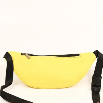Vibrant yellow fanny pack with multiple compartments and adjustable straps. Color: Yellow Length: 5.5 inches Width: 10 inches Height: 4 inches Price: ₹800/-