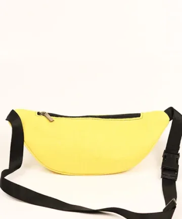 Vibrant yellow fanny pack with multiple compartments and adjustable straps. Color: Yellow Length: 5.5 inches Width: 10 inches Height: 4 inches Price: ₹800/-
